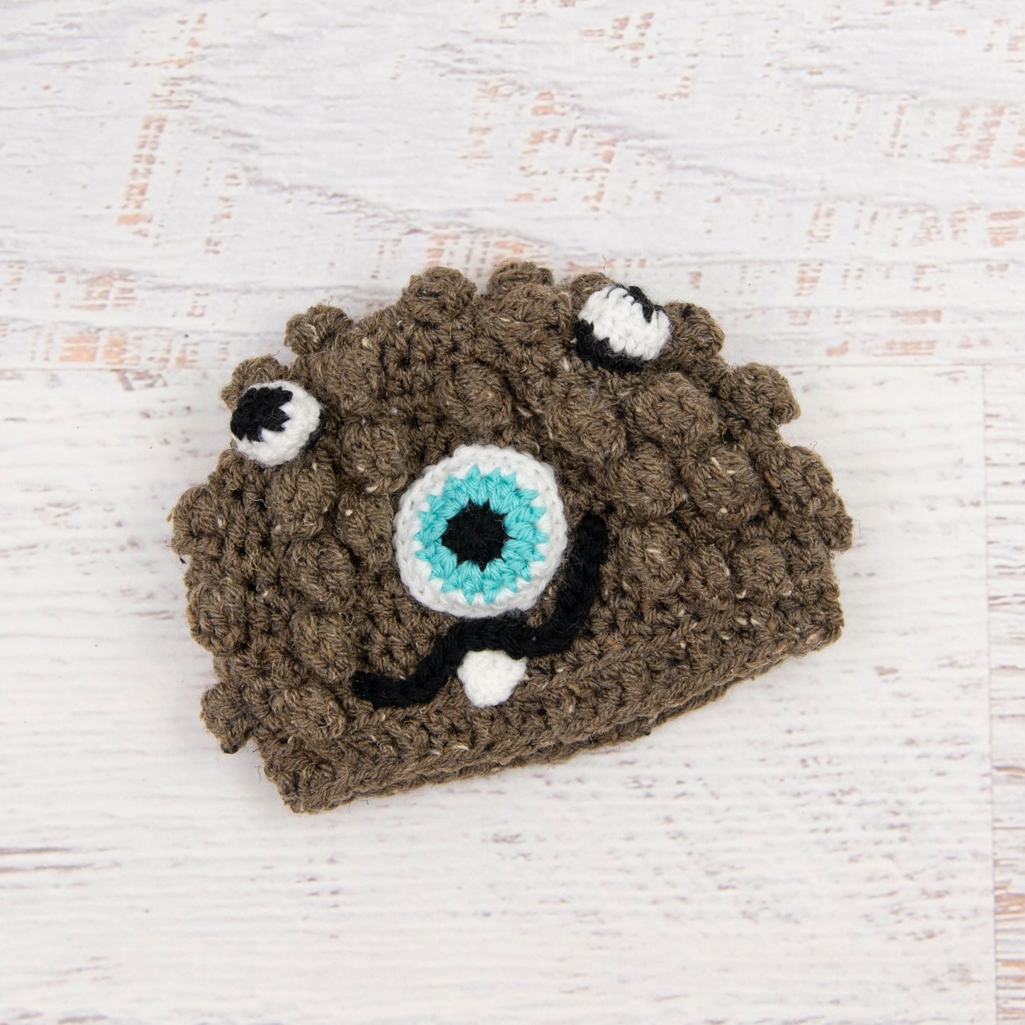 In-Stock 0-6 Month Little Monster in Barley with Aqua Marine Eye.