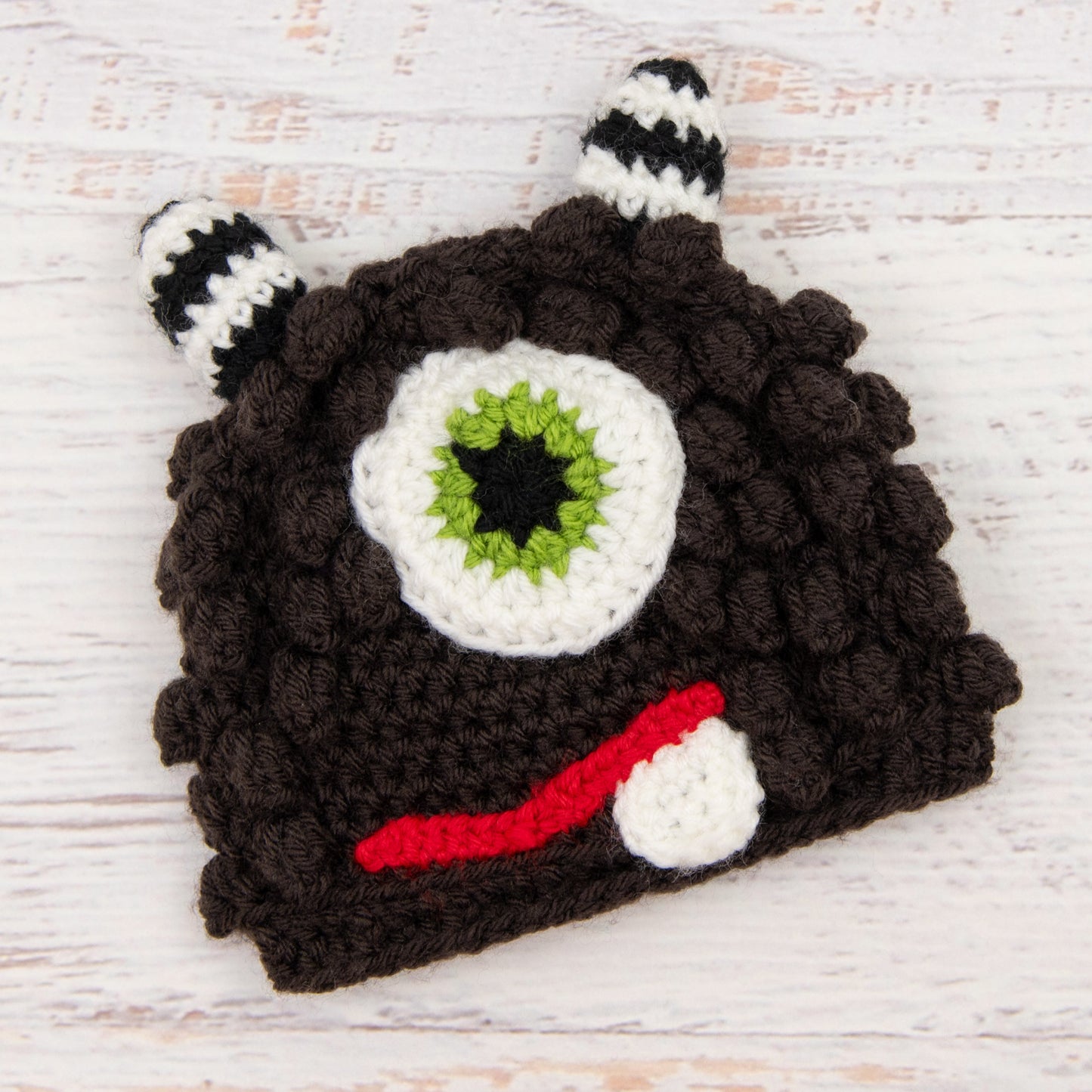 In-Stock 6-12 Month Little Monster in Expresso with Fern Eye.