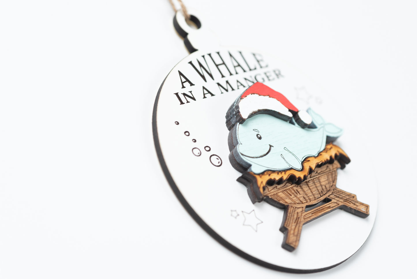 A Whale in a Manger Christmas Ornament