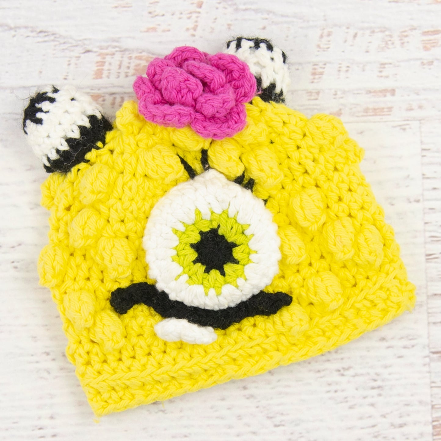 In-Stock 0-6 Month Cotton Little Monster in Banana Yellow with Hot Pink Flower.